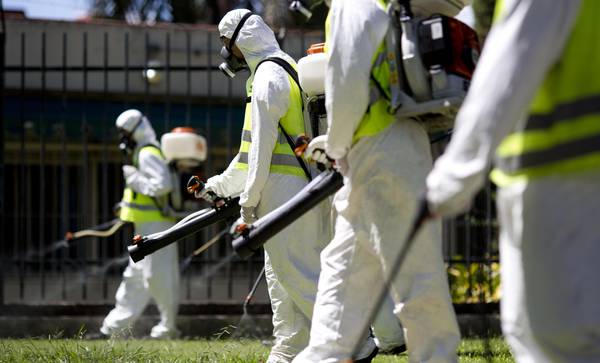 A fumigation brigade sprays an area of Chacabuco Park in a Aedes mosquito control effort, in Buenos Aires, Argentina, Wednesday, Jan. 27, 2016. Zika virus is spread by the same Aedes mosquito as dengue fever and chikunguya. The U.S. Centers for Disease Control says researchers have found strong evidence of a possible link between Zika and a surge of birth defects in Brazil. (ANSA/AP Photo/Natacha Pisarenko)